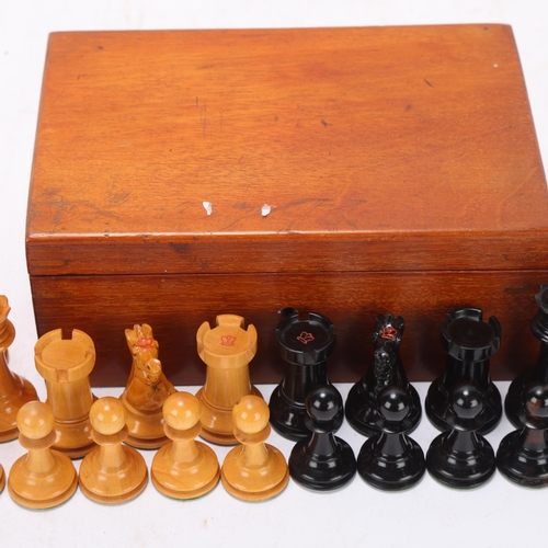 533 - A Staunton pattern chess set, boxwood and ebonised, with weighted bases, King height 6.5cm, in mahog... 