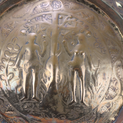 536 - An Antique brass alms dish, 17th or 18th century, depicting Adam and Eve, diameter 50cm