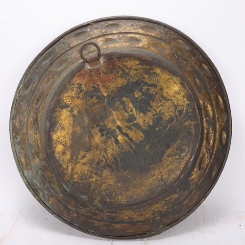 536 - An Antique brass alms dish, 17th or 18th century, depicting Adam and Eve, diameter 50cm