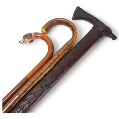 538 - A walking stick with carved and painted wood dog's head handle, and 2 other sticks (3)