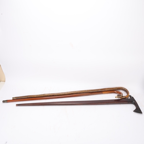 538 - A walking stick with carved and painted wood dog's head handle, and 2 other sticks (3)