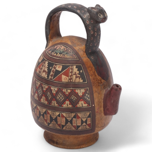 542 - A 16th century Peruvian terracotta ceremonial chicha pot, with puma handle and geometric painted pan... 