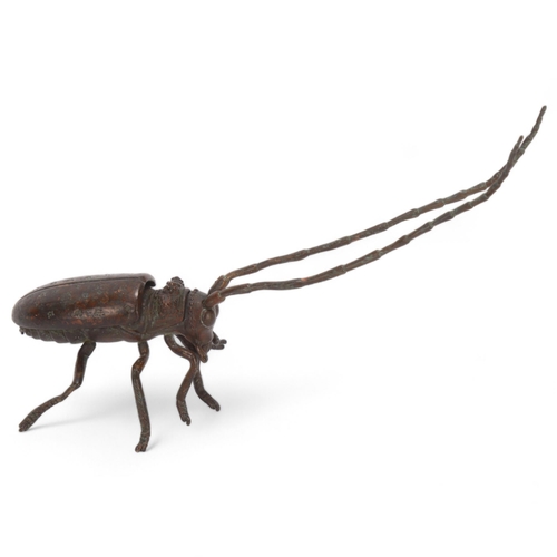 553 - A Meiji period century Japanese patinated bronze jizai okimono articulated cricket, length 13cm