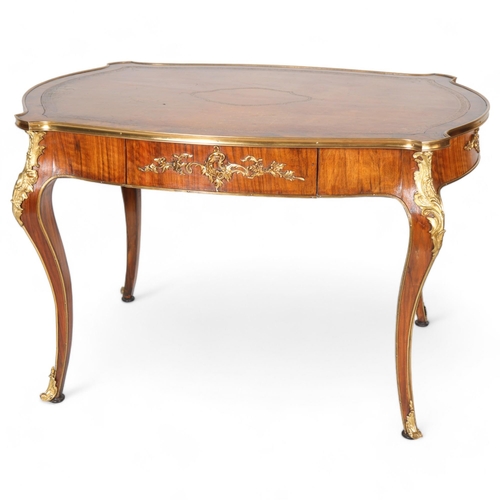 365 - A French walnut library table, early to mid-20th century, with shaped top, single frieze drawer on c... 