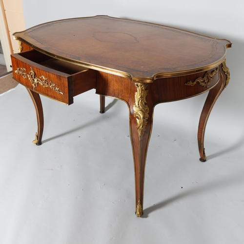 365 - A French walnut library table, early to mid-20th century, with shaped top, single frieze drawer on c... 