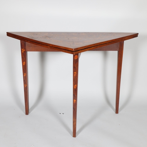 367 - An 18th century Dutch marquetry triangular fold over table, width 115cm