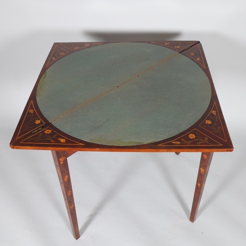 367 - An 18th century Dutch marquetry triangular fold over table, width 115cm