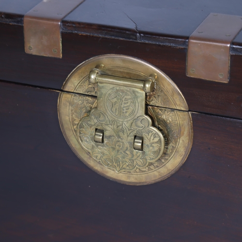 380 - A 19th century Chinese brass-bound camphorwood travelling chest, with heavy engraved bronze carrying... 