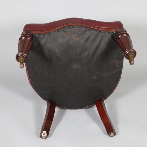 492 - An early 19th century mahogany framed bow-arm office chair, with buttoned Morocco leather upholstery... 