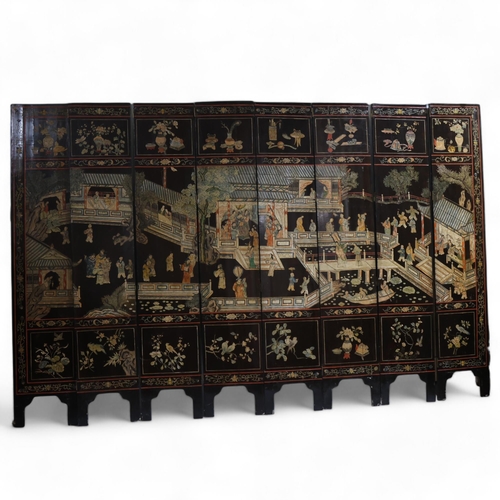 493 - A large Chinese relief carved and lacquered 8-section screen, early 20th century, height 213cm (7')