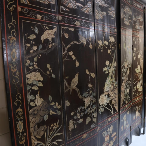 493 - A large Chinese relief carved and lacquered 8-section screen, early 20th century, height 213cm (7')