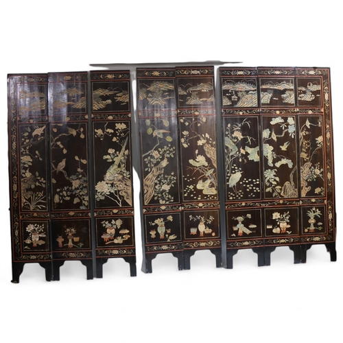 493 - A large Chinese relief carved and lacquered 8-section screen, early 20th century, height 213cm (7')