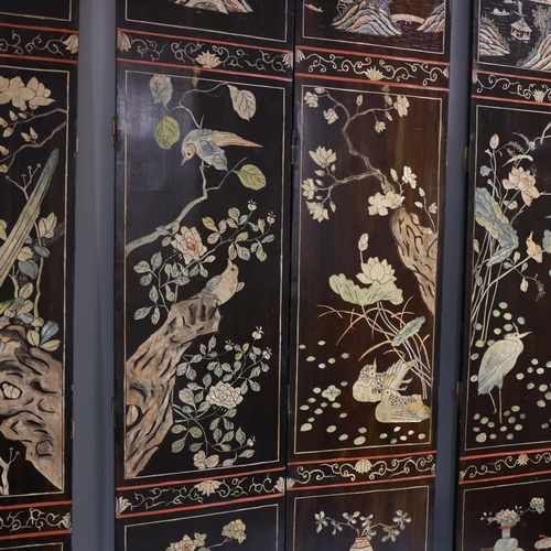 493 - A large Chinese relief carved and lacquered 8-section screen, early 20th century, height 213cm (7')