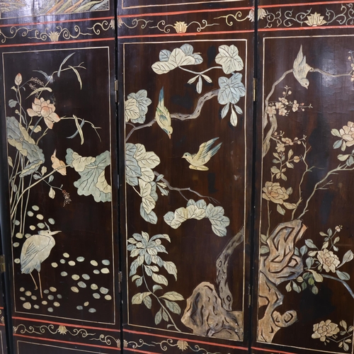 493 - A large Chinese relief carved and lacquered 8-section screen, early 20th century, height 213cm (7')