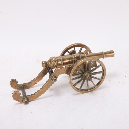 417C - A Victorian brass table cannon with adjustable screw range setting, length 23cm