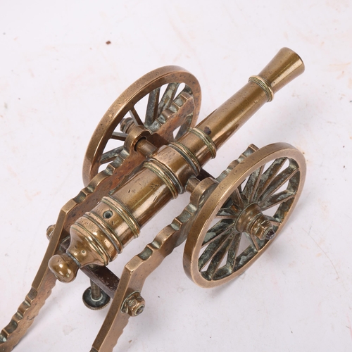 417C - A Victorian brass table cannon with adjustable screw range setting, length 23cm