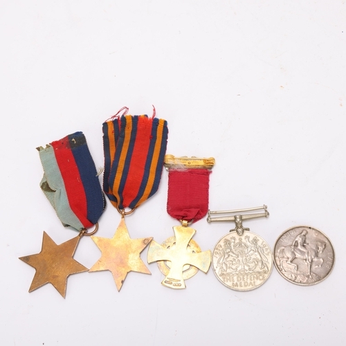 417 - A First World War medal to G24345 PTE. VG Everest, The Queens Reg, 3 Second World War medals and a s... 