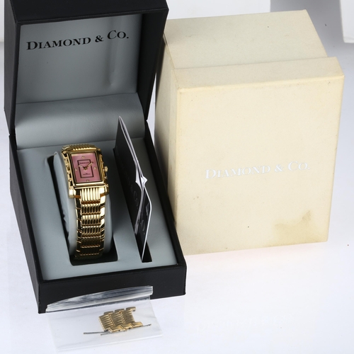 1035 - DIAMOND & CO - a lady's gold plated stainless steel quartz bracelet watch, ref. DC012, pink mother-o... 