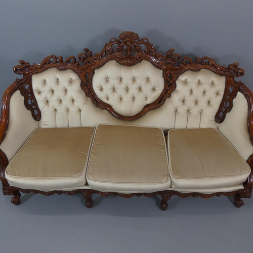 2109 - A Continental hardwood three piece suite, comprising a three-seater settee, 203x116x90cm and A pair ... 