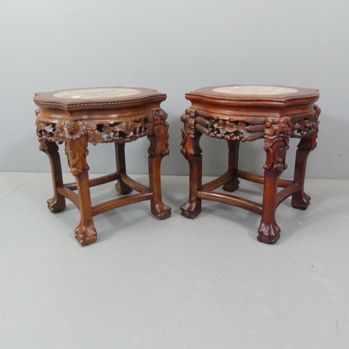 2110 - A pair of Chinese mahogany jardiniere stands, with inset marble tops, and carved and pierced decorat... 