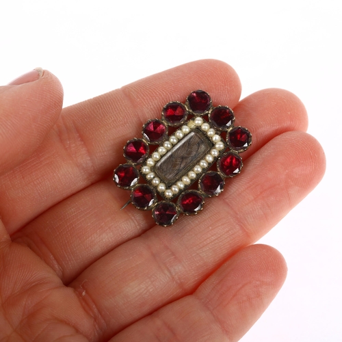 1303 - A Georgian flat-top garnet pearl and hairwork mourning brooch, circa 1820, central woven hair panel ... 