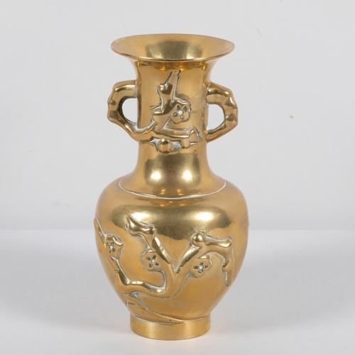 562 - A Chinese bronze vase with blossom decoration, and dragon stamp to base, height 19cm