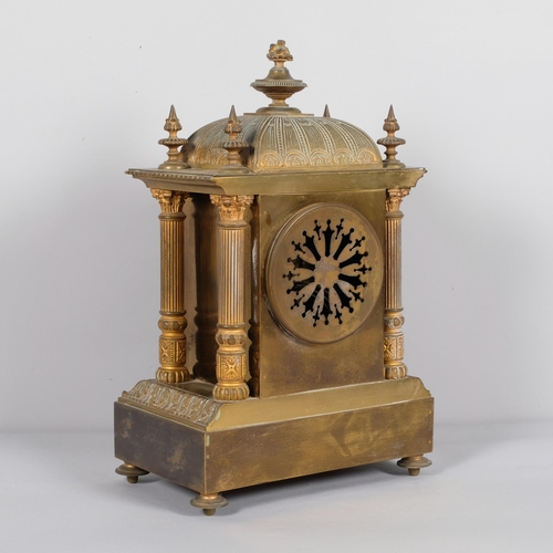 565 - A French 8-day brass architectural mantel clock, with Corinthian pillars to 4 corners, striking on a... 