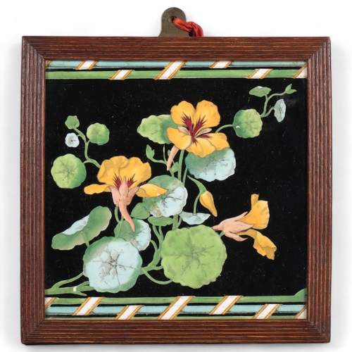 567 - A Minton's Aesthetic Movement block print tile of nasturtium, in dark oak frame