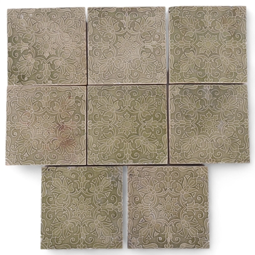 572 - A set of 8 Minton tiles with piped green decoration, 15cm square