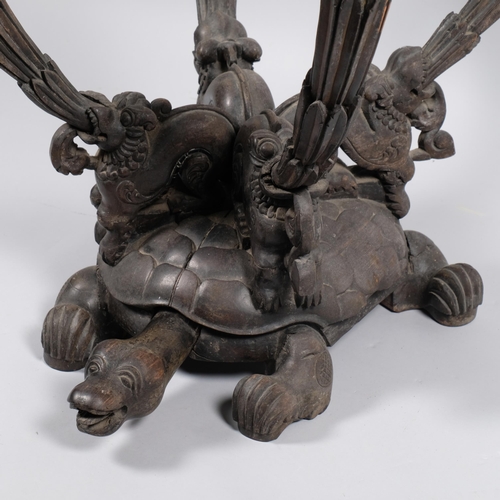 578 - A 19th century hardwood carved Chinese side table, 4 dogs of fo on back of turtle, with specimen mar... 