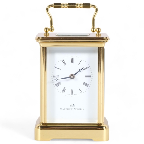 581 - A Matthew Norman, Swiss made brass cased carriage clock, 11 jewels, No 1754, case height 11cm