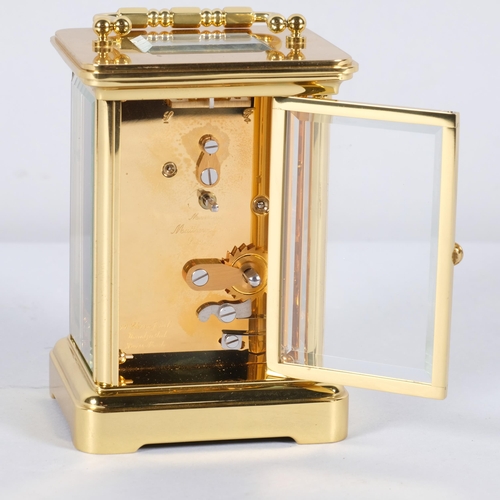 581 - A Matthew Norman, Swiss made brass cased carriage clock, 11 jewels, No 1754, case height 11cm