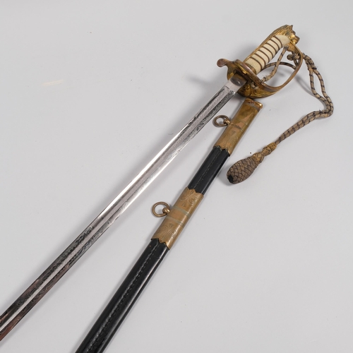 417H - A George VI Naval Officer's sword, with gilt-bronze mounts  and leather sheath and faux shagreen han... 