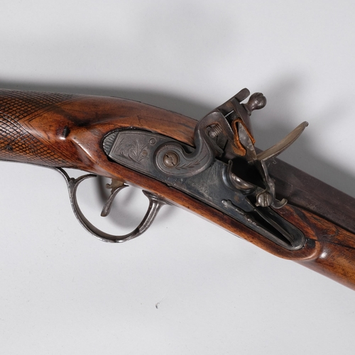 417L - A 19th century long barrelled flintlock fowling gun by Cook, good patinated walnut stock, engraved m... 