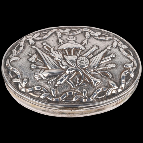 1469 - An 18th century Continental silver snuffbox, oval form with relief embossed weapon armaments decorat... 