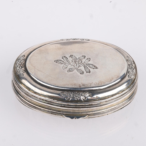 1469 - An 18th century Continental silver snuffbox, oval form with relief embossed weapon armaments decorat... 