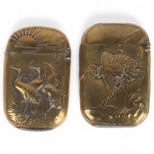 582 - Two Japanese brass vesta cases with crane decoration, longest 4.5cm