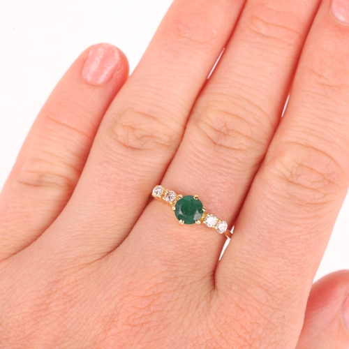 1293 - A modern emerald and diamond dress ring, apparently unmarked, setting height 7.2mm, size O, 2.4g