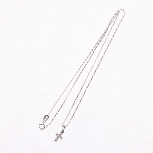 1300 - A modern 9ct white gold diamond cross pendant necklace, on  9ct white gold fine curb link chain, pen... 