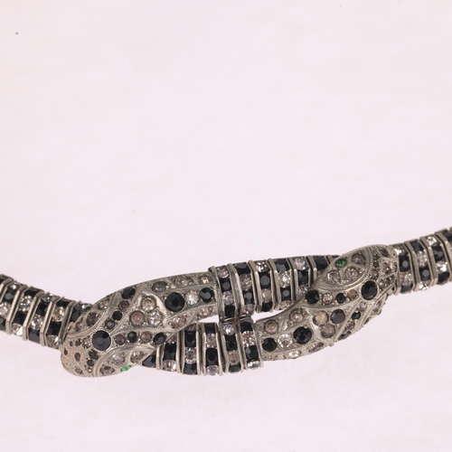 1321 - SCHREIBER & HILLER - an Art Deco German rhinestone snake collar necklace, the double entwined snakeh... 