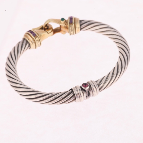 1322 - DAVID YURMAN (NEW YORK) - an American sterling silver and 14ct gold gem set hinged bangle, the twist... 