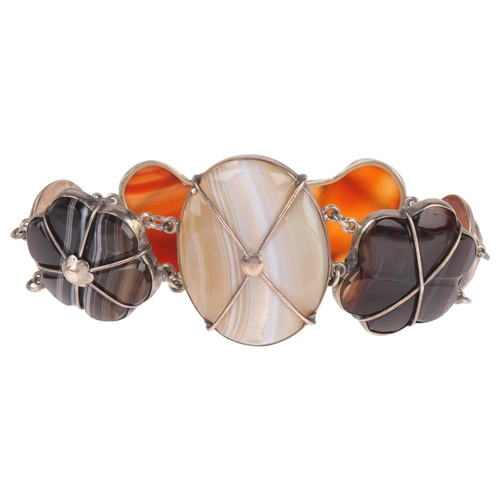 1326 - A Scottish silver hardstone panel bracelet, set with polished shaped banded agate and carnelian, lar... 