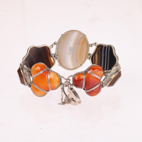 1326 - A Scottish silver hardstone panel bracelet, set with polished shaped banded agate and carnelian, lar... 