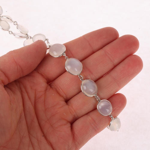 1332 - A sterling silver moonstone Riviere necklace, set with round and oval cabochon moonstones, 52cm, 24.... 