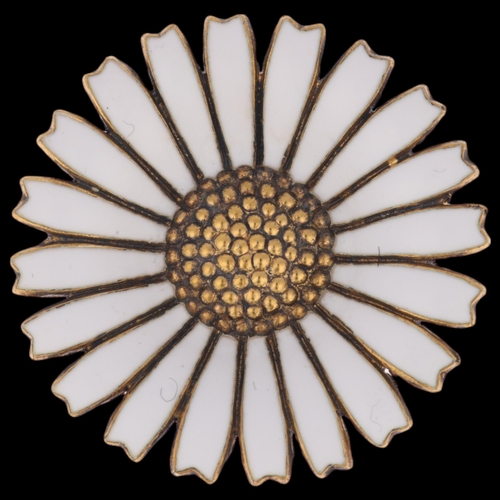 1344 - GEORG JENSEN - a Danish modernist vermeil sterling silver and white enamel daisy pattern brooch, 32.... 