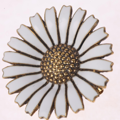 1344 - GEORG JENSEN - a Danish modernist vermeil sterling silver and white enamel daisy pattern brooch, 32.... 