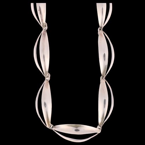 1357 - CARL OVE FRYDENSBERG - a Danish modernist sterling silver openwork panel necklace, curved ellipse fo... 