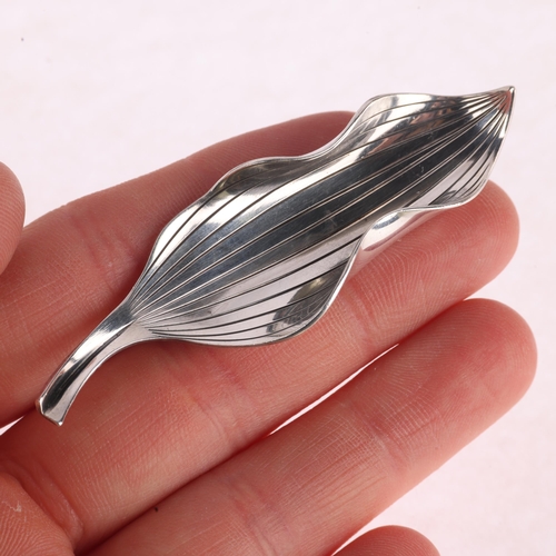 1370 - ANTON MICHELSEN - a Danish modernist sterling silver leaf brooch, designed by Gertrude Engel Rougie,... 