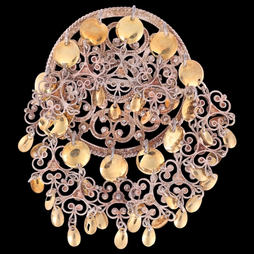 1387 - TONE VIGELAND - a Norwegian sterling silver-gilt Folk Art brooch, with filigree flowerhead drops, 91... 