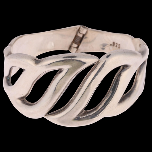 1396 - A large Danish modernist sterling silver openwork hinged bangle, with spring fitting, setting height... 